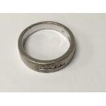 A 9 ct gold ring inset with five diamonds 5 grams