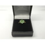 A 9ct gold ring set with a tsavorite in the form o