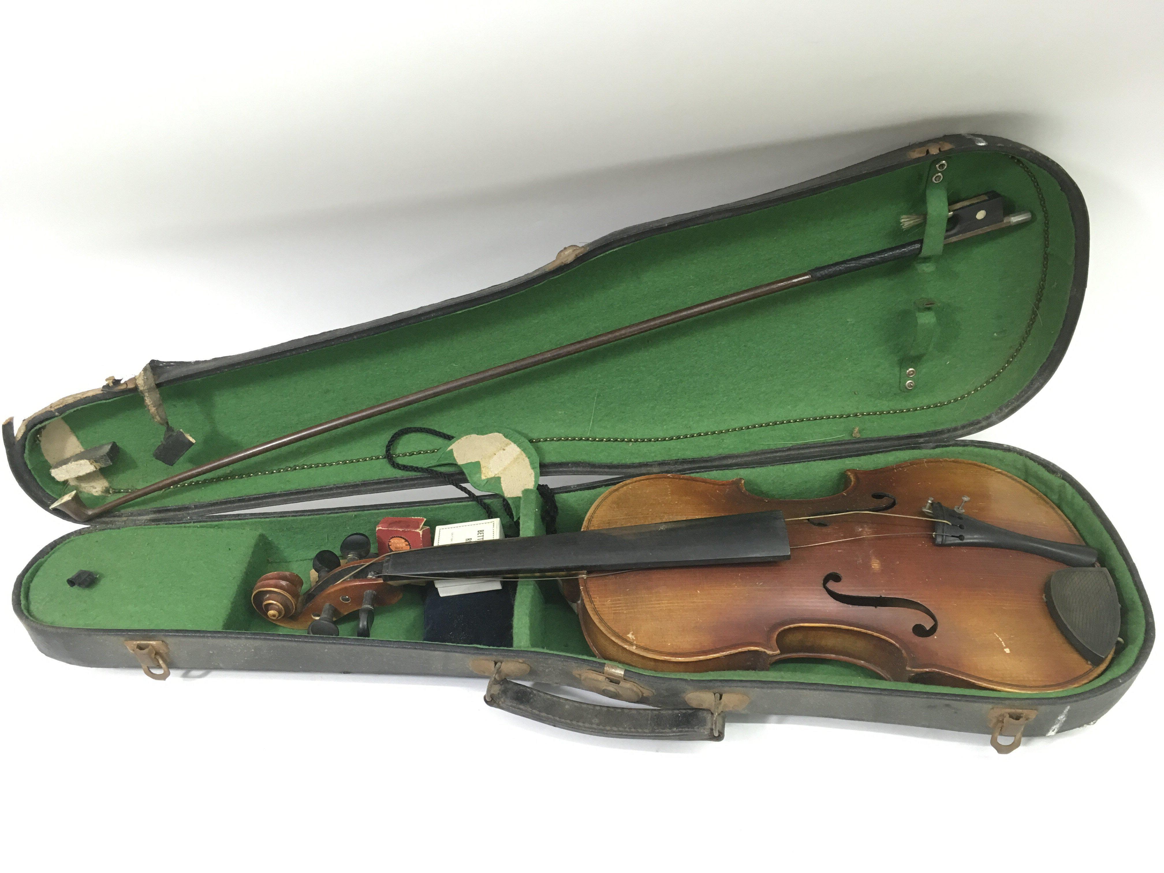 An unlabelled cased violin, a/f