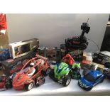 A large box of remote controlled vehicles includin