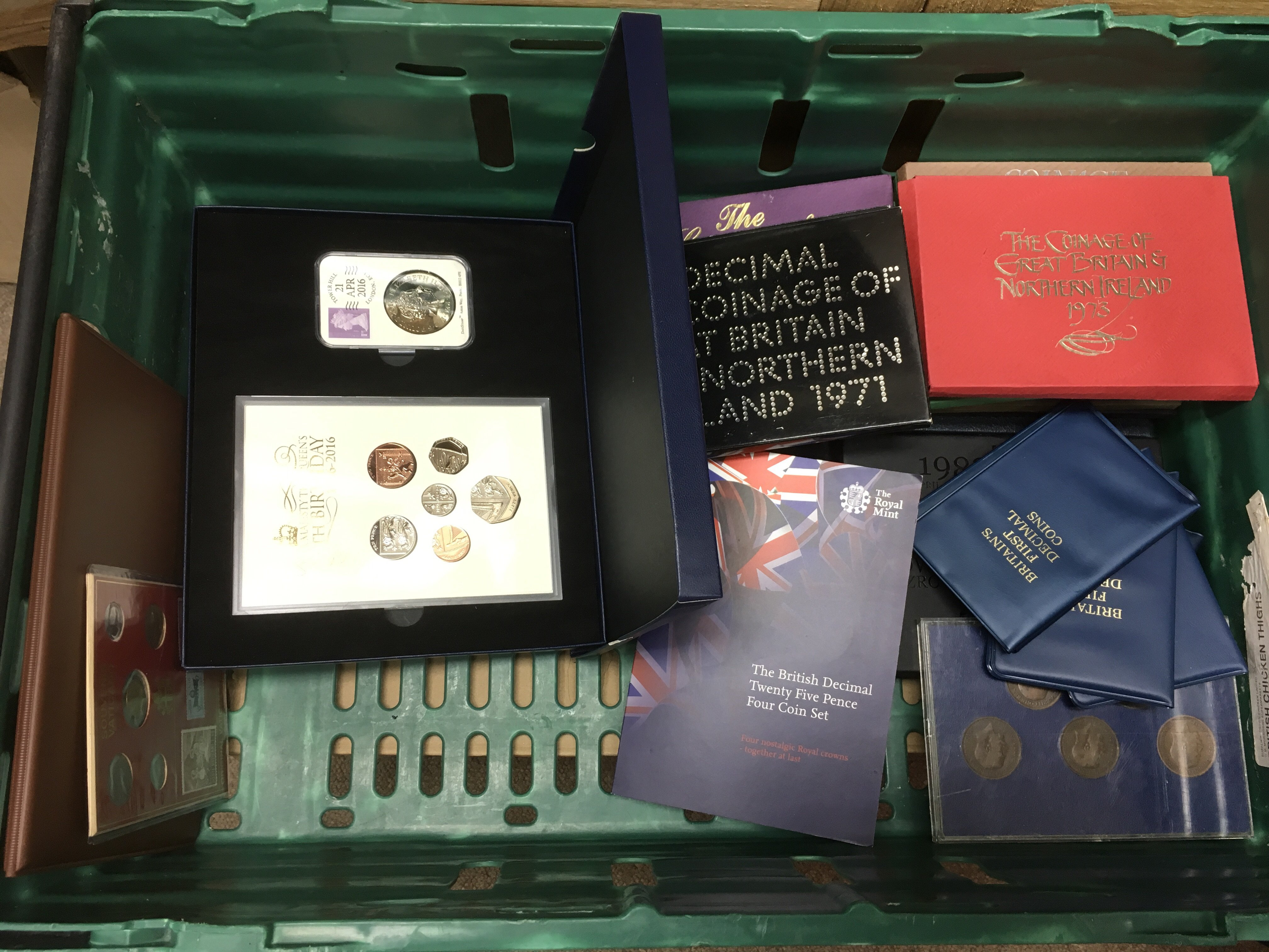 A crate of Commemorative proof coins and coin cove