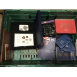 A crate of Commemorative proof coins and coin cove