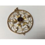 A unmarked gold Edwardian pendant of circular form