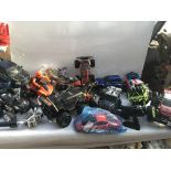 A large box of remote controlled vehicles, all wit