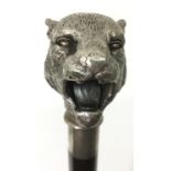 A walking cane with silver head shaped as a tiger