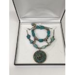 A vintage turquoise necklace and a turquoise brace