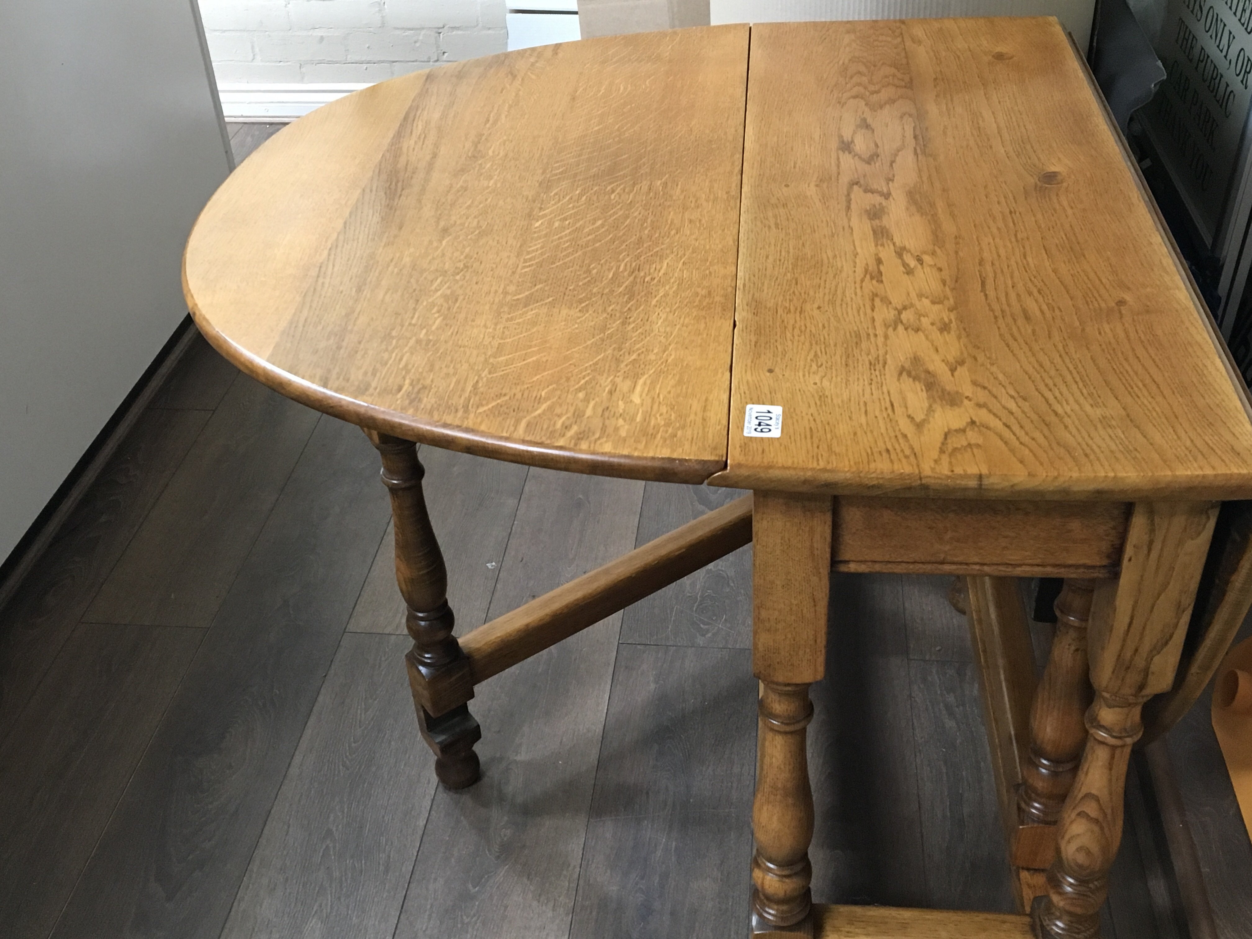 A solid light oak drop leaf table the twin flap top on turned legs. - Image 3 of 3