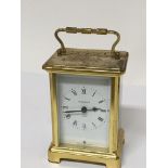 A brass cased French carriage clock the dial and back plate with retailer and makers Duverdrey &