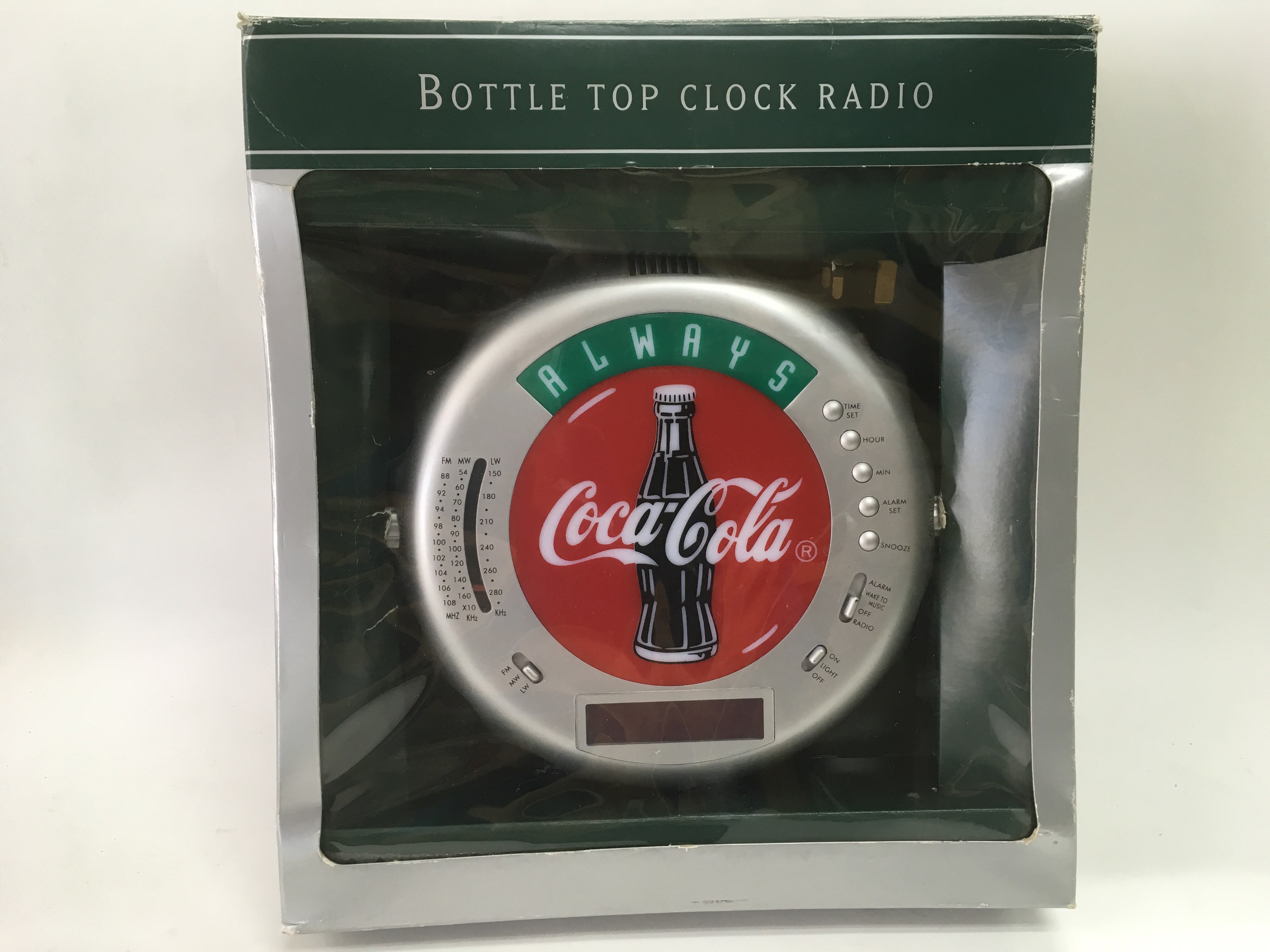 A boxed Coca Cola bottle top clock radio - NO RESE