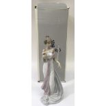 A boxed Lladro figure ' Summer Infatuation' Approx