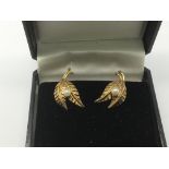 A pair of 9ct gold and pearl earrings in the form