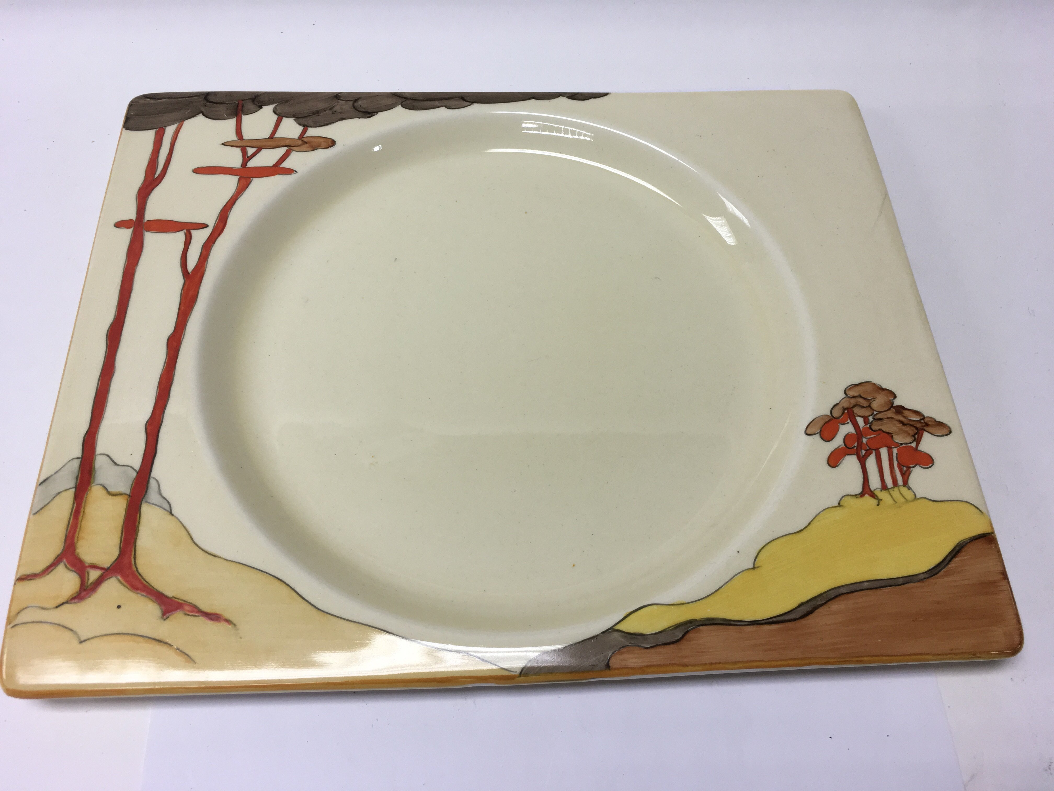 A coral firs Clarice Cliff square plate 26 cm