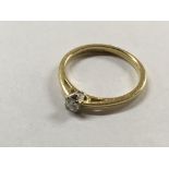 An 18ct gold solitaire ring, approx P, 2.8g