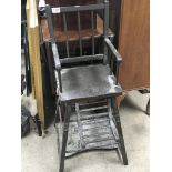 A vintage painted wood folding childs high chair -