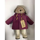 A Paddington Bear soft toy.