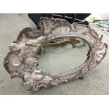Two Italian style mirrors with swept frames.