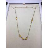 An 18ct gold and citrine necklace, approx 3.8g..