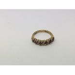 An 18ct gold ring set with alternating diamonds an