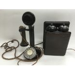 A circa 1920s candlestick telephone and bell box.