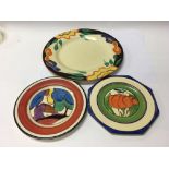 A Clarice Cliff side plate decorated in the autumn