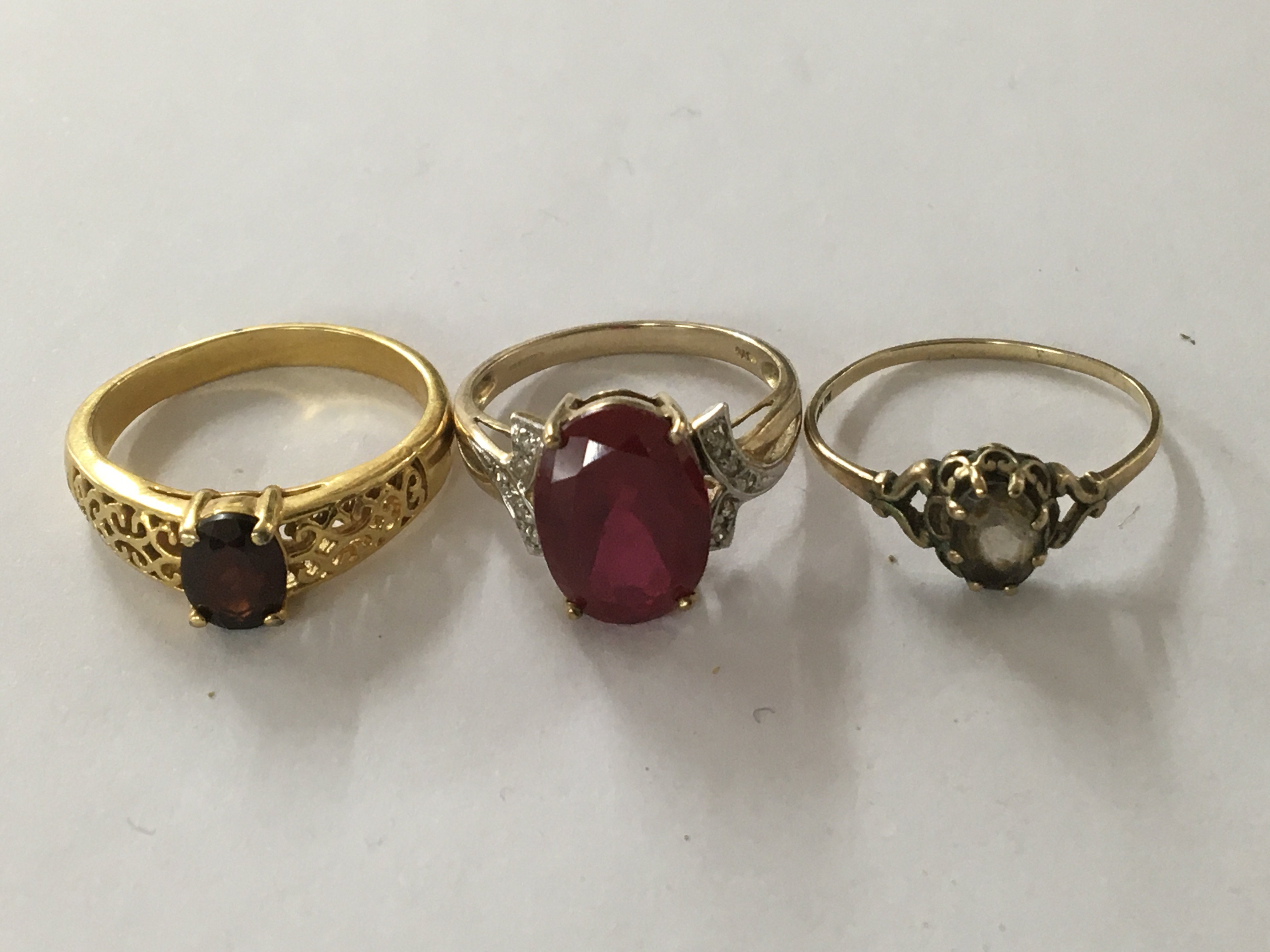 Two 9 ct gold rings And one unmarked ring