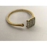 An 18ct gold, square cut ring set with diamonds, damaged