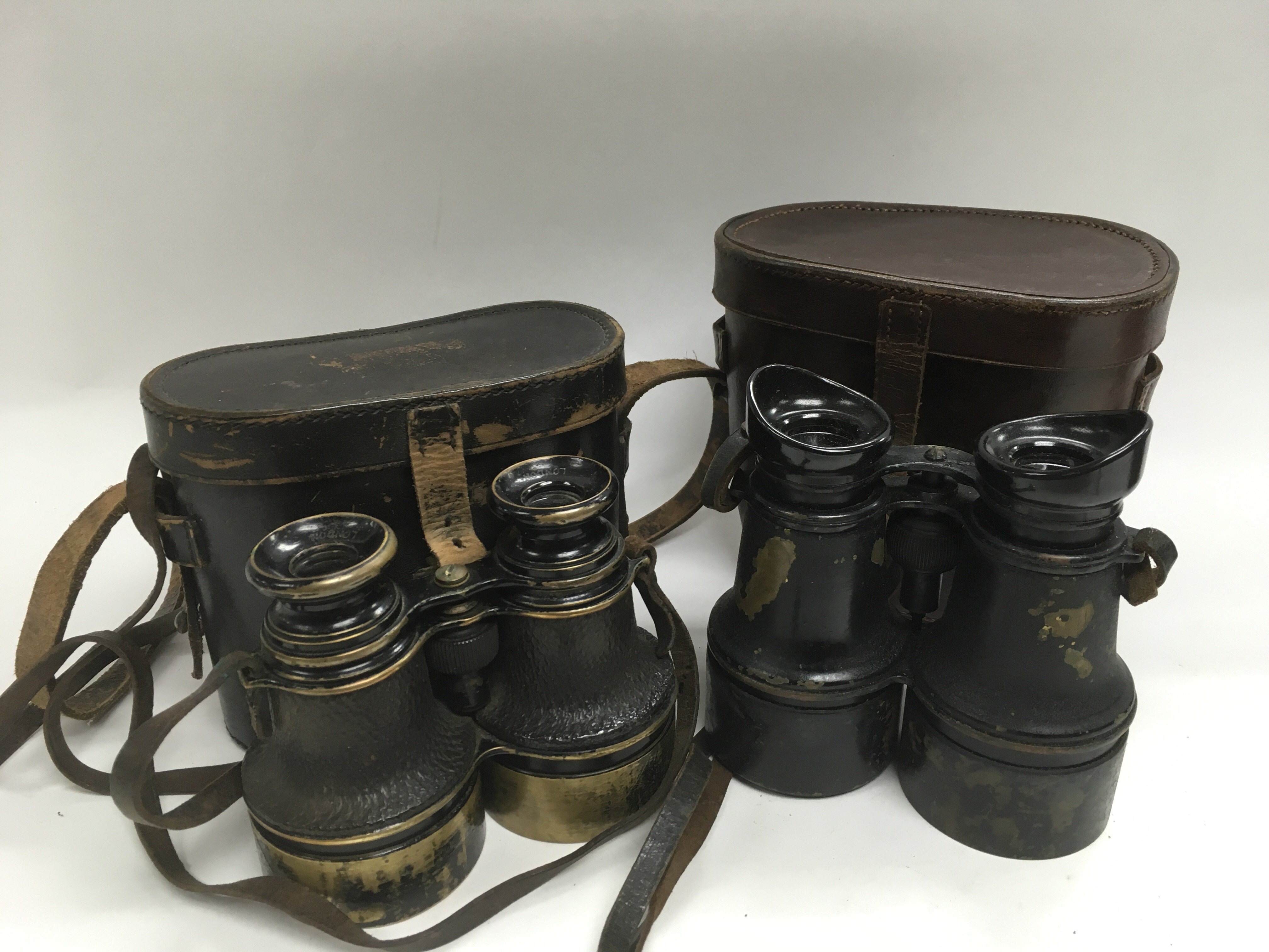 Two pairs of military binoculars, circa WW1.