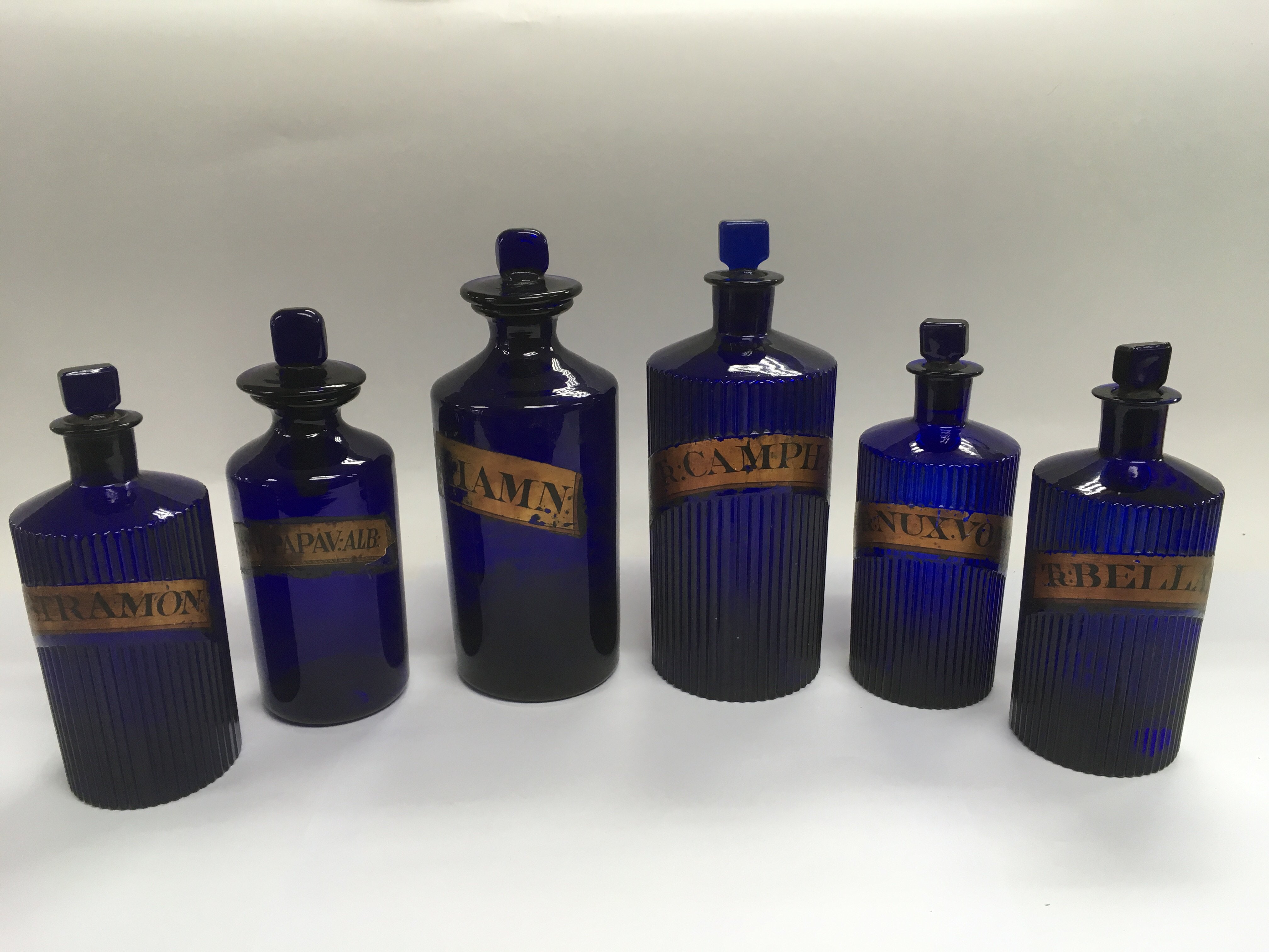 Six Victorian blue glass apothecary bottles, large