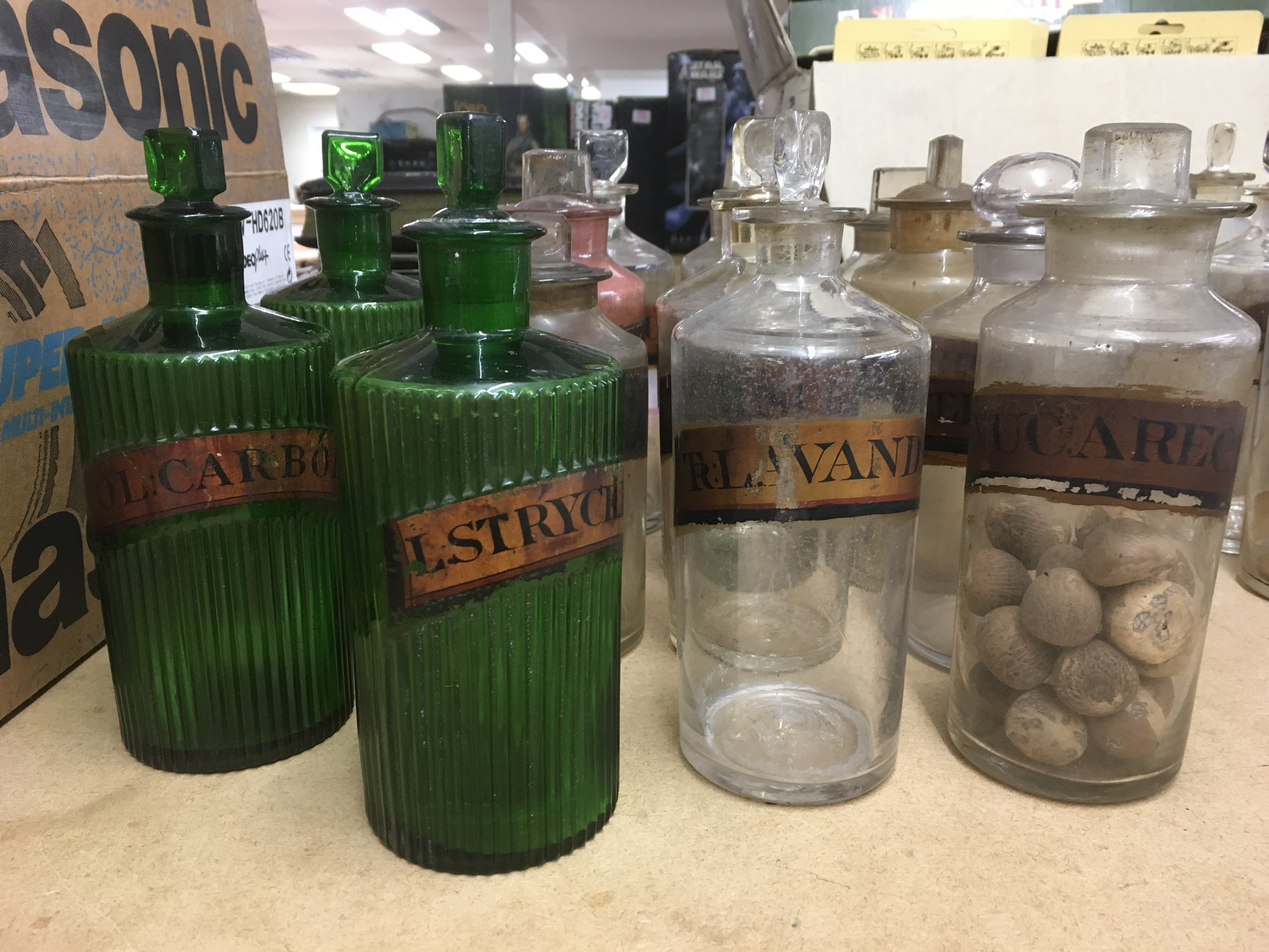 A collection of Victorian apothecary bottles inclu