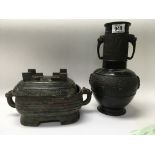 A Chinese bronze vase and a bronze jar and cover