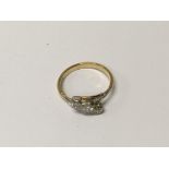 A 18 ct three stone diamond ring size k