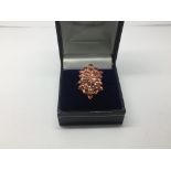 A 9ct gold, ruby and diamond cluster ring, approx