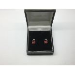 A pair of 9ct gold red and white topaz earrings, a