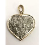 A 9ct gold and diamond set heart shaped pendant