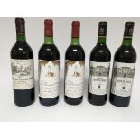 Five bottles of wine comprising Chateau La Tour de