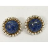 A pair of 18ct gold clip earrings set with large L