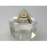 A heavy 18ct gold gents ring set with a diamond, a