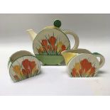 A Clarice Cliff crocus circular tea pot with match