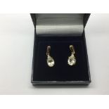 A pair of 9ct gold, rutile and white sapphire drop