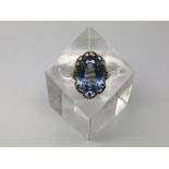 An attractive oval aquamarine coloured stone set i
