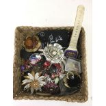 A small basket containing dress jewellery