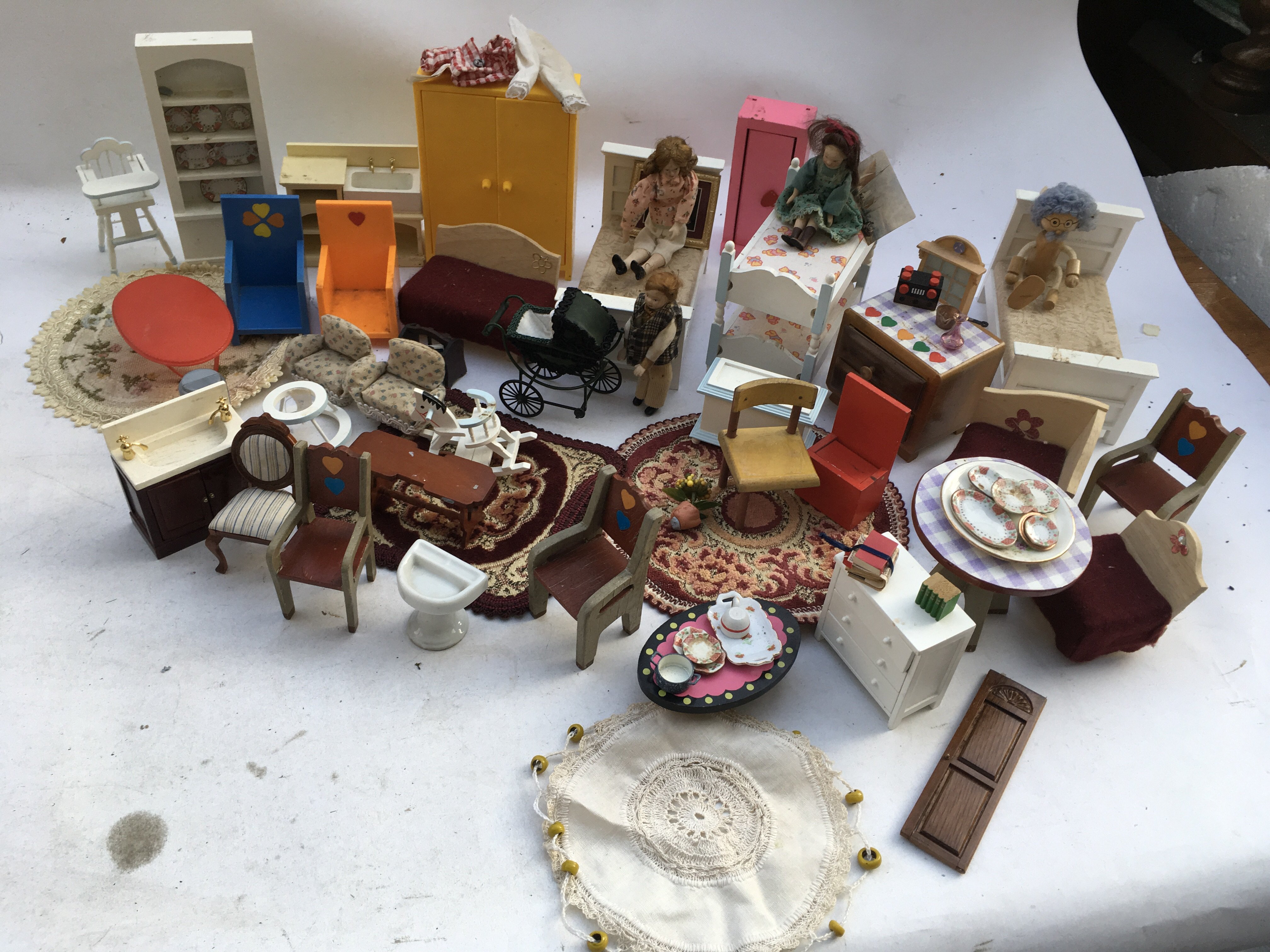 A box containing a collection of Dolls house furni