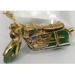 An unusual 18ct gold motorcycle brooch, set with a
