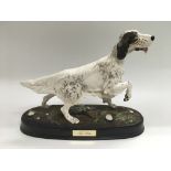 A Royal Doulton figure of a dog titled 'The Setter