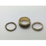 Three yellow metal rings, approx 10.9g.