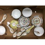 A collection of Chinese bowls and spoons
