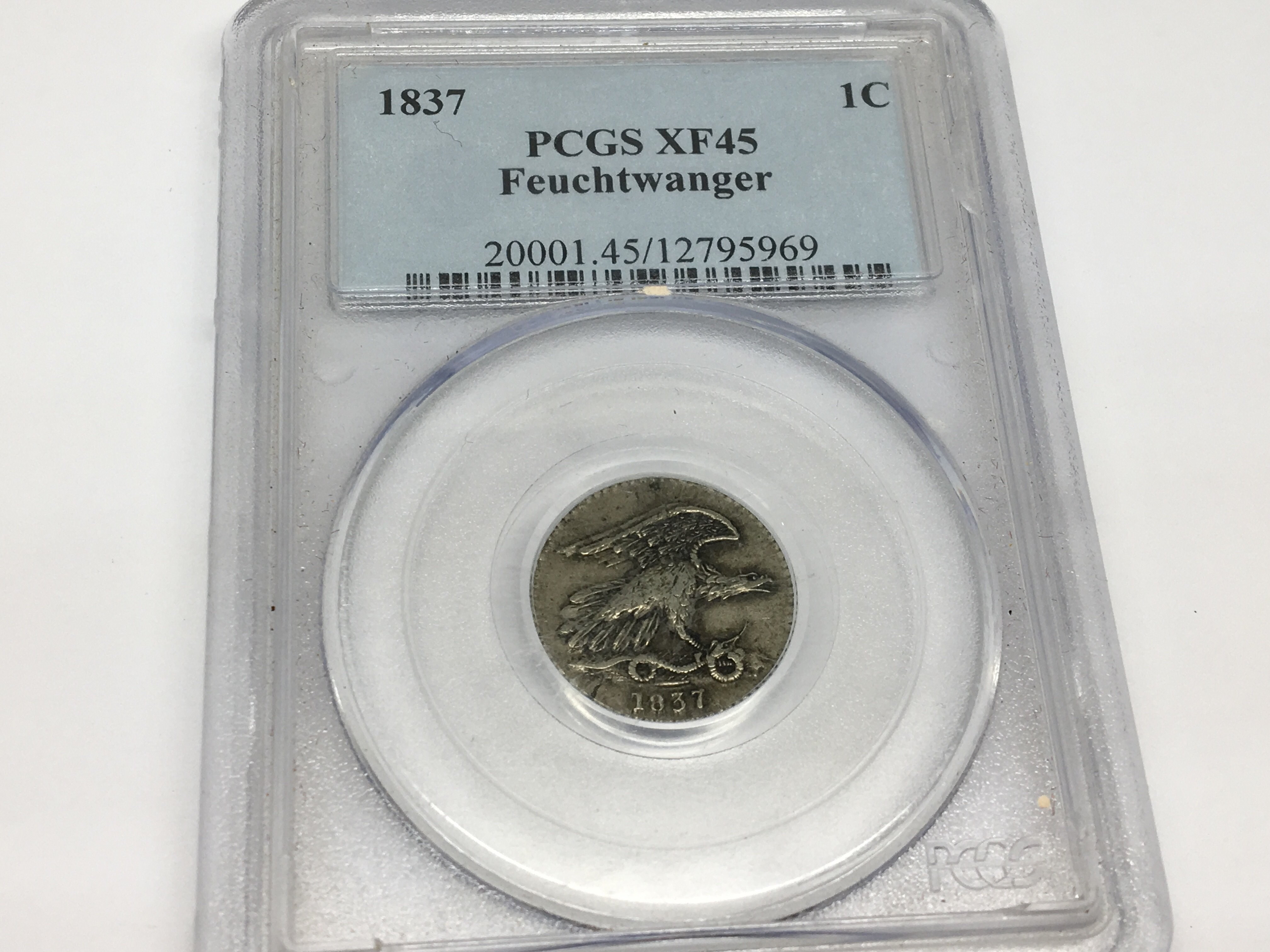 An 1837 Feuchtwanger one cent in PCGS official reg