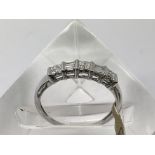 An 18ct white gold diamond ring set with princess
