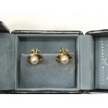 A pair of 9ct gold and cultured pearl clip on earr
