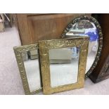 Three wall mirrors comprising a brass framed example, approx heights 78cm, 58cm and 54cm.